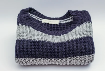 navy grey striped knit sweater folded